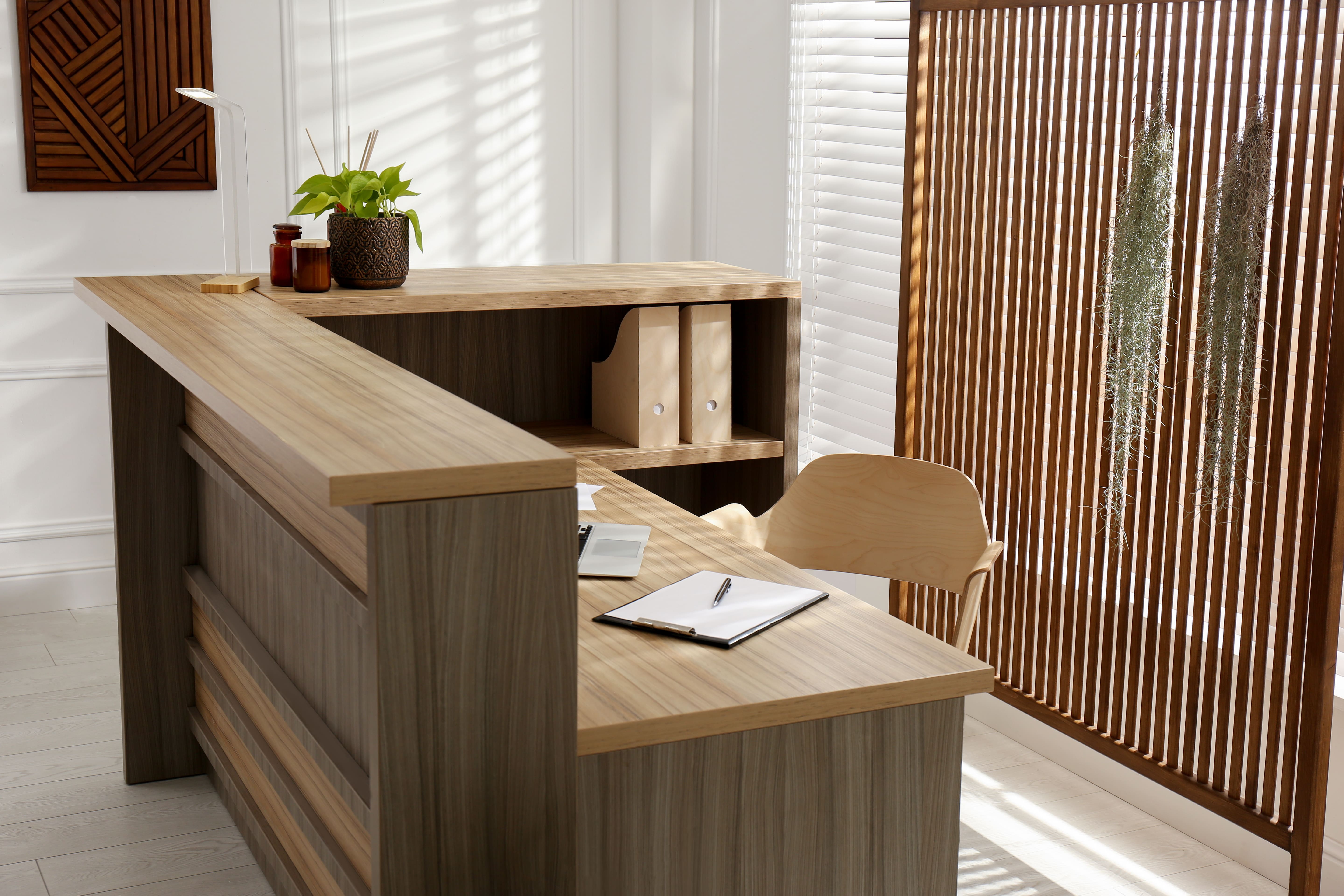 Modern office workspace with custom wooden desks and ergonomic furniture