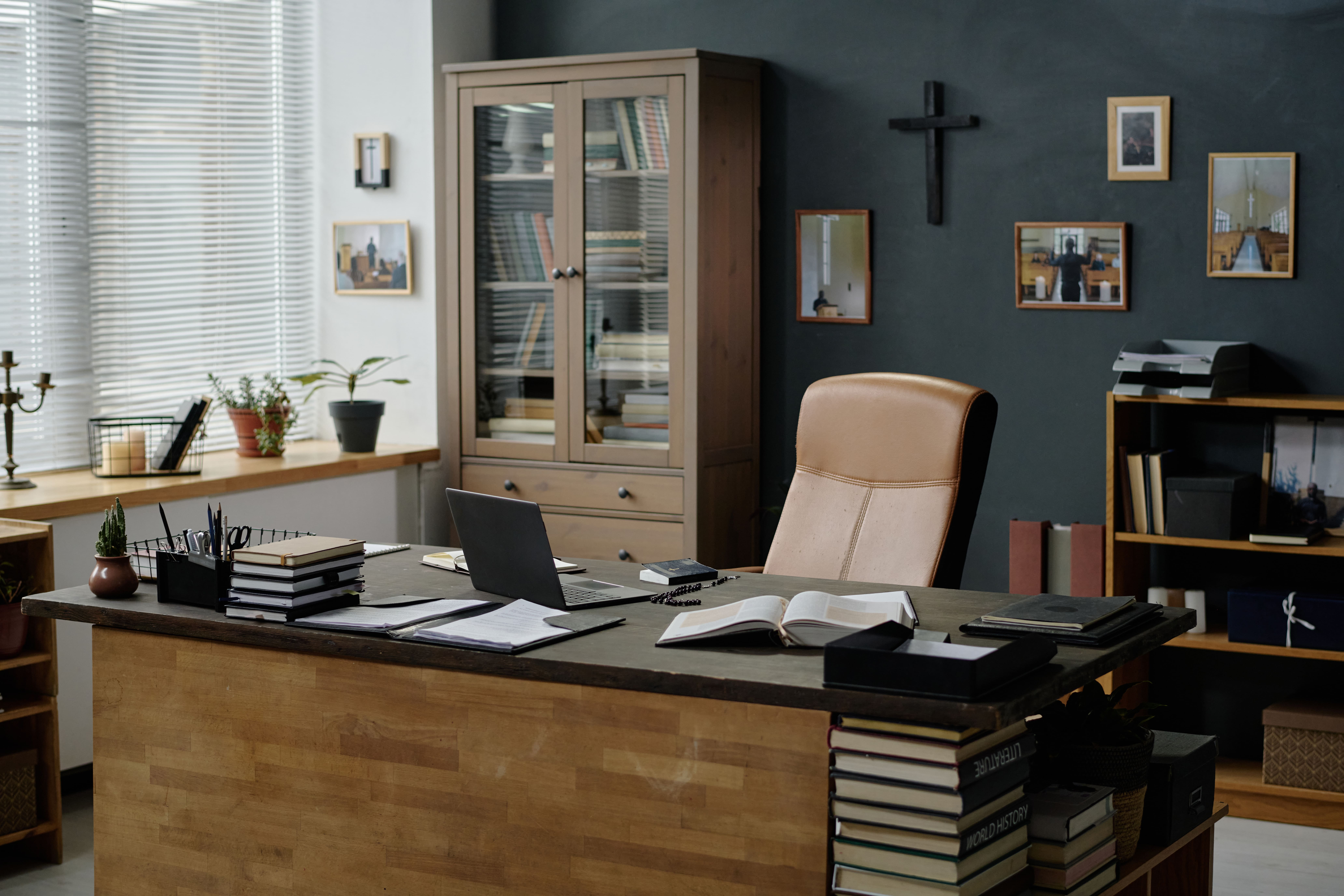 Professional conference room with large custom wooden table and comfortable seating